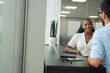 © Cultura Creative - Business people having meeting in modern office