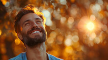 Joyful Man Embracing Sunlight.
Smiling man enjoying a moment of happiness in the golden sunlight.