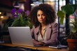 An African American businesswoman focused on her laptop