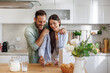 © ivanko80 - Happy young couple enjoying breakfast together in kitchen