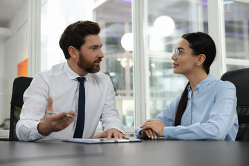 Poster - Lawyers with clipboard working together at table in office