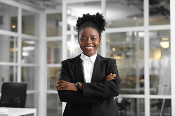 Canvas Print - Happy woman with crossed arms in office. Lawyer, businesswoman, accountant or manager