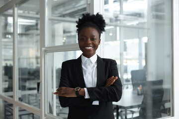 Wall Mural - Happy woman with crossed arms in office. Lawyer, businesswoman, accountant or manager