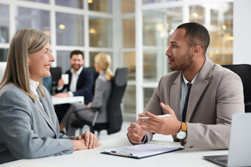 Sticker - Lawyers working together at table in office, selective focus