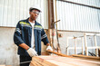 © chokniti - African American man carpenter working in wood business workshop. black people technician craftman, Timber industry tool factory, woodwork for construction or wooden furniture job