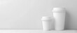 Two beige Plastic Disposable Cup or Coffee Paper Cup with white cap isolated on light grey background. take away. mockup.