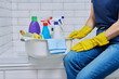 © Valerii Honcharuk - House cleaning concept, basin with cleaning products and hands in gloves