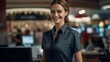 Capture the engaging moment of a smiling, young, and attractive saleswoman, doubling as a cashier, providing exemplary service to customers. 