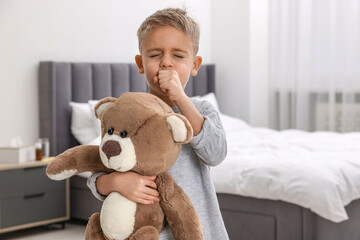 Sticker - Sick boy with teddy bear coughing at home