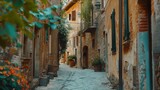 Fototapeta Uliczki - An image of a narrow cobblestone street in an old town. Suitable for historical or travel-themed designs