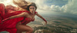 Dramatic shot of Superhero woman in red cape flying in the sky