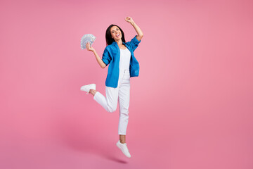 Canvas Print - Full length photo of ecstatic overjoyed woman wear stylish shirt white pants jumping hold money win bet isolated on pink color background