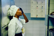 Distraught black female chef in kitchen in restaurant.