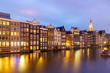 Wall Mural - Typical old dutch houses over canal with reflections at twilight in Amsterdam, North Holand, Netherlands. Amsterdam postcard.