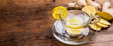 Fototapeta Kwiaty - a glass cup of ginger tea