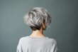 © pundapanda - Rear view of a girl with short haircut gray hair, care and hair care concept