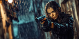 Fototapeta Panele - Young woman in black jacket points gun in rain, police officer or killer holding weapon at night. Female detective with pistol on dark street. Concept of spy, thriller movie, murderer