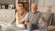 © Stockphotodirectors - Elderly woman comforting her ill husband in bedroom