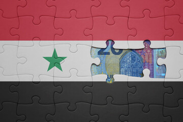 puzzle with the national flag of syria and euro banknote. finance concept