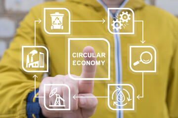 Man using virtual touch screen presses inscription: CIRCULAR ECONOMY. Concept of circular economy for future growth of business to reuse and renewable material resources and environment sustainable.