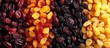 A blend of dried fruits including cranberries, yellow raisins, and black raisins displayed on a table in a close-up view.