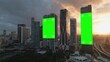 © Michele - Aerial of smart city skyline at sunset with empty billboard green screen with tracking markers on modern buildings skyscraper