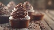 Chocolate cupcakes with rich frosting and cocoa nibs for a tempting and indulgent sweet treat
