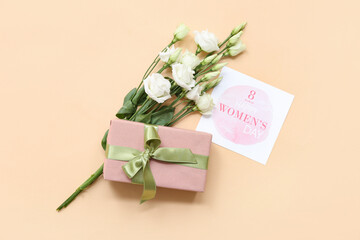 Sticker - Card with text 8 MARCH HAPPY WOMEN'S DAY, gift box and beautiful white eustoma flowers on beige background