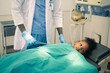 © Suriyo - Doctor treating a kid patient in the operating room