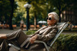 Portrait of a confident mature businesswoman in a business suit, relaxing in a city park. 
