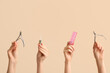 © Pixel-Shot - Female hands with pipette for cuticle oil, nail cutters and brush on beige background