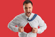 © Pixel-Shot - Angry superhero businessman tearing his shirt on red background