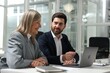 © New Africa - Lawyers working together at table in office