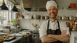 © Deb Borba - Male chef in a chef's hat in a kitchen with crossed arms