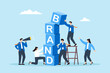 Business team build word BRAND using blocks. Concept of brand awareness, strategies to promoting products and sales, marketing, and advertising to enhance company reputation