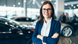 Successful businesswoman in a car dealership, sale of vehicles to customers.

