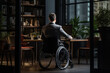 Person with Disability sitting in a wheelchair at his workplace in an office building