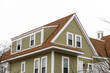 Exterior view of a newly built family house with shed dormer windows on a winter day in Brighton, MA, USA