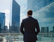 © Kurniawan - Corporate Reflections - Suited Businessman Amid Modern Glass Office Tower