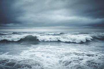 Wall Mural - A large body of water with powerful waves crashing against a rocky coastline, Stormy ocean waves under a graying sky, AI Generated