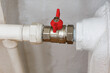 © Boris - Ball valve with red handle when closed. Shut-off valves for the heating system of the apartment. Turn off the faucet.
