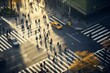 An overhead shot of busy urban life as people cross a street casting long shadows