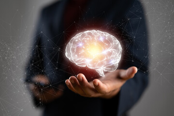 Leinwandbilder - Businessman holding human brain and icon customer digital network with effective business mindset on paper texture background.