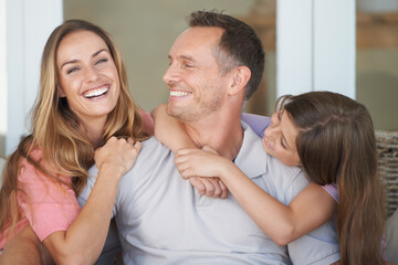 Poster - Mom, dad and girl on sofa with smile, embrace and relax in playful bonding together in family home. Mother, father and daughter on couch with love, weekend fun and care for happy man, woman and child