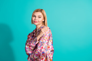 Poster - Photo of gorgeous nice woman with bob hairstyle dressed print blouse hug herself enjoy fresh laundry isolated on teal color background