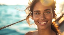 Beautiful woman with radiant smile sunlit hair and sparkling eyes enjoying a serene moment on a boat with the vast ocean as a backdrop.