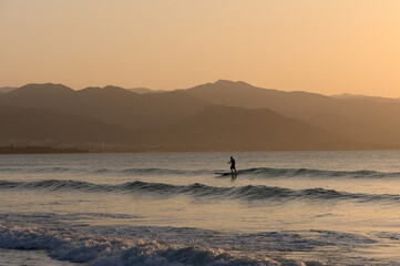 man doing sup boarding on the mediterranean sea 2