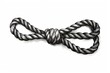 Black and white engraving of rope tied in sea knot on white background, retro style illustration.