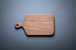 Walnut handmade wooden cutting board on tabletop. Wood cutting board background. wooden label on a wooden background.