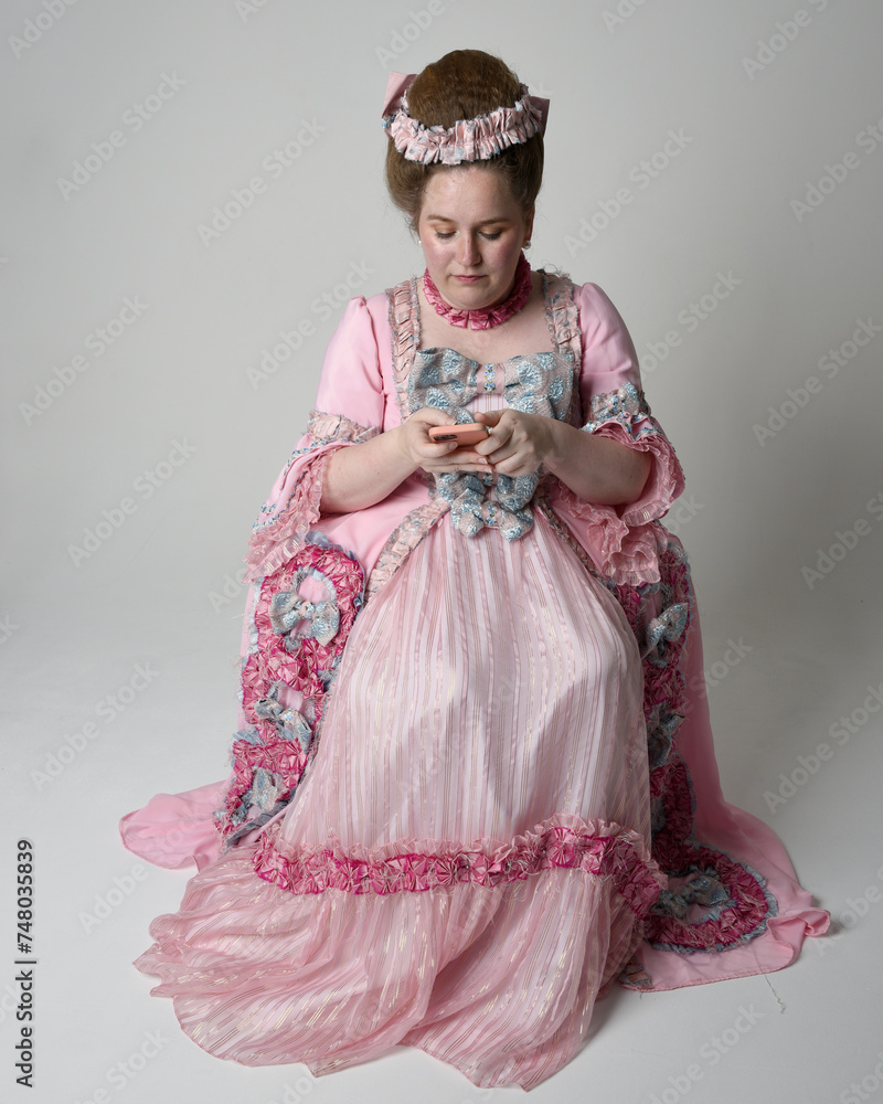 Nobility Style Full length portrait female model wearing opulent pink gown costume of ...